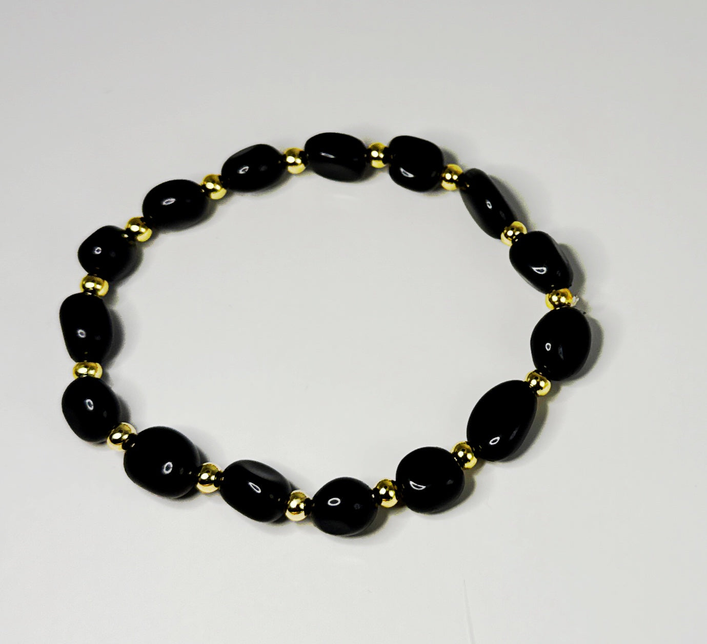 **Sleek Black Jasper and Gold Bracelet**