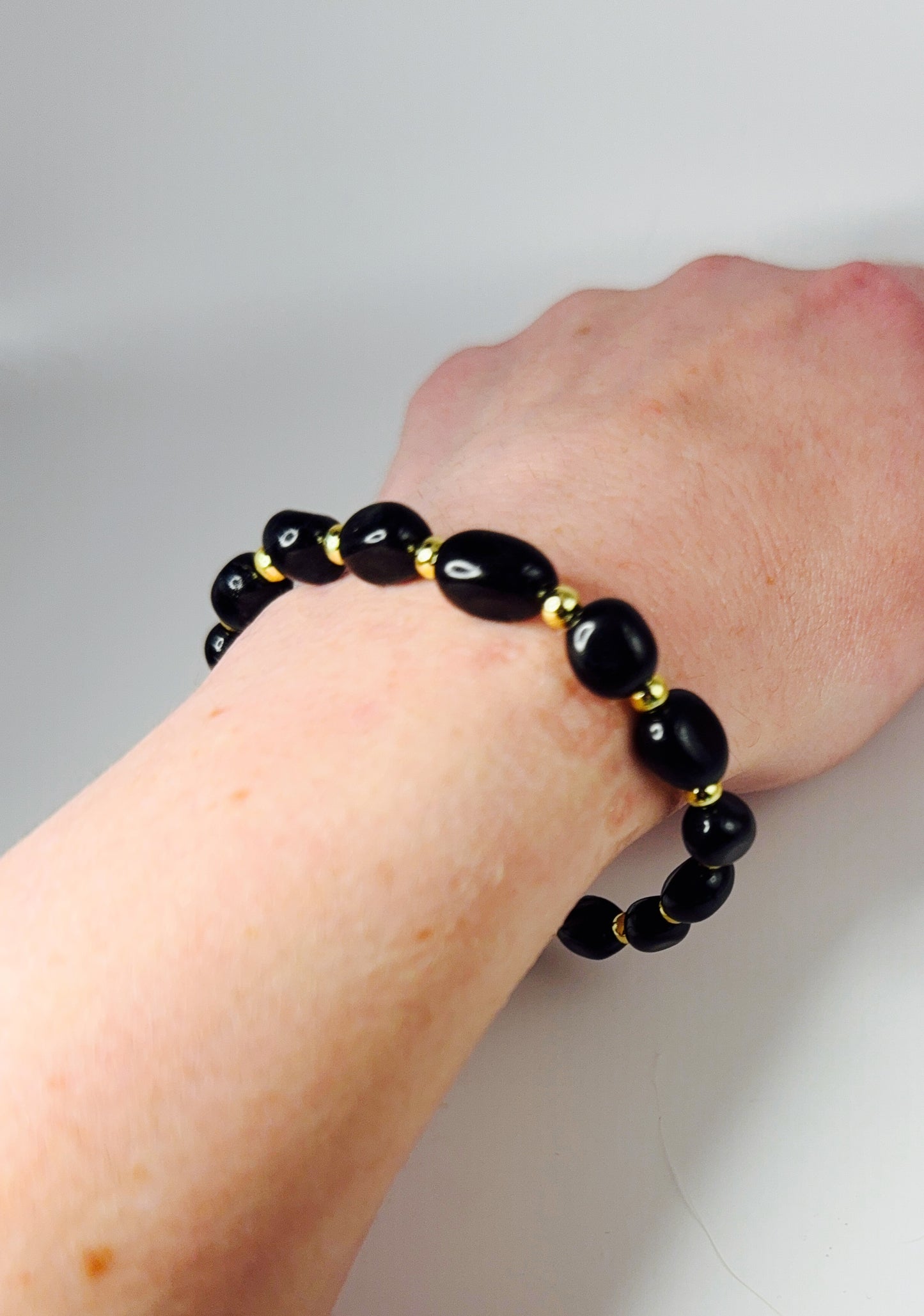 **Sleek Black Jasper and Gold Bracelet**