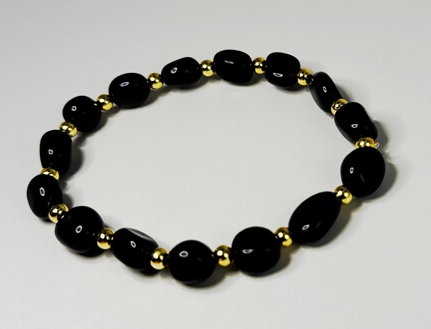 **Sleek Black Jasper and Gold Bracelet**