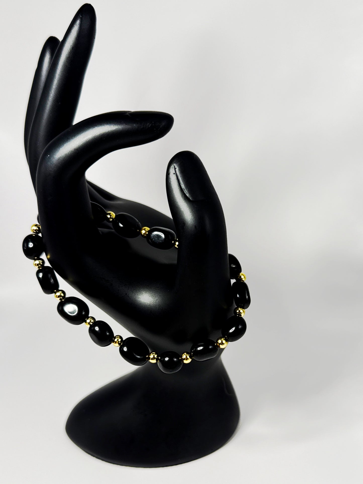 **Sleek Black Jasper and Gold Bracelet**