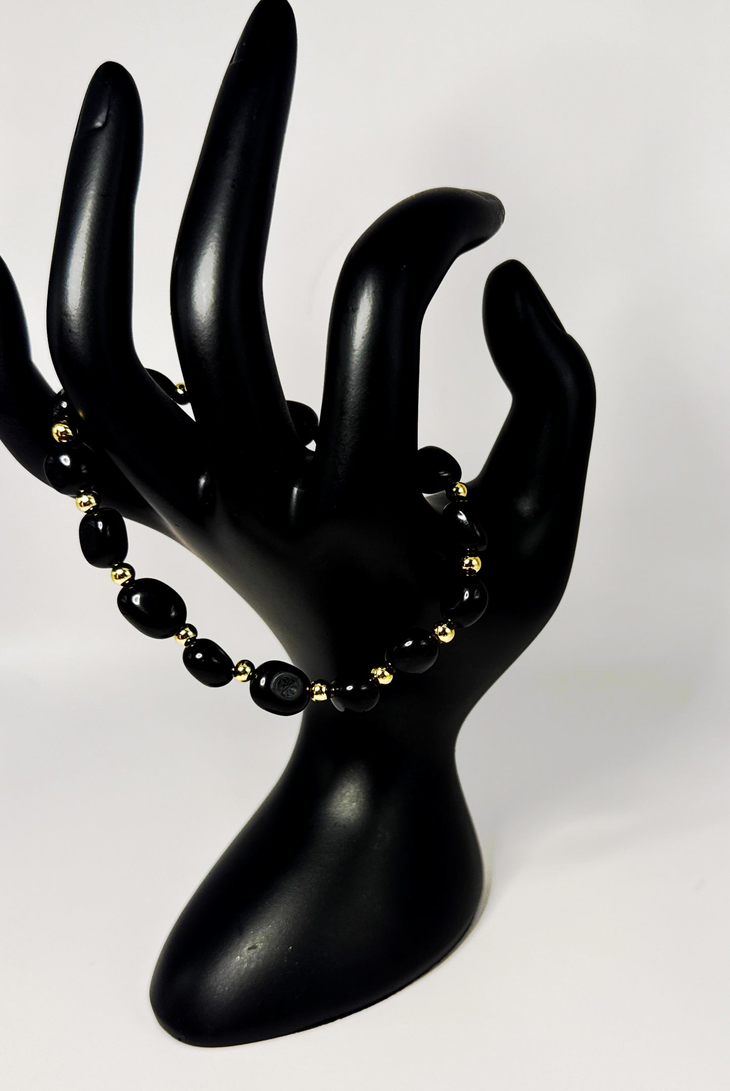 **Sleek Black Jasper and Gold Bracelet**